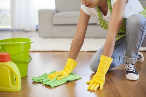 Deep cleaning a fabric sofa with equipment
